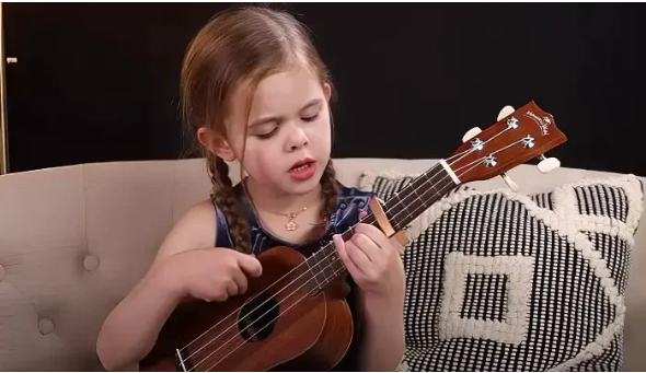 A 6-Year-Old Showcases Their Talent by Playing the Ukulele and Singing Elvis’ Classic, “Can’t Help Falling in Love”