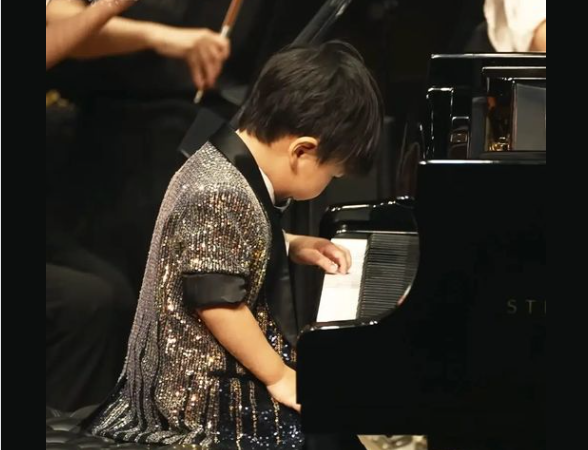 At Just Three Years Old, Toddler Barron Showcases His Musical Prowess Alongside an Orchestra