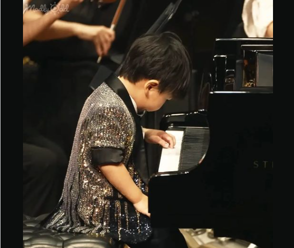 At Just Three Years Old, Toddler Barron Showcases His Musical Prowess Alongside an Orchestra