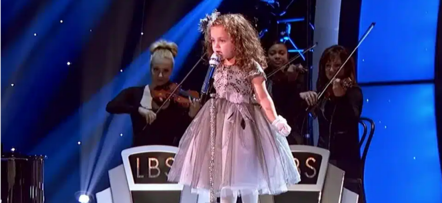 This has never happened before in history. When This 4-Year-Old Girl Started Signing A 40-Year-Old Song, The Entire Crowd Gasped. Watch video in comment below